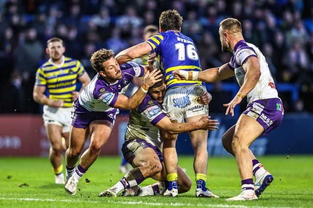Liam Byrne of Warrington Wolves is tackled by Tyson Smoothy of Wakefield Trinity during the Betfred Super League Round 3 match Warrington Wolves vs Wakefield Trinity at The Halliwell Jones Stadium, Warrington, United Kingdom on 28 February 2026

(Photo by Alfie Cosgrove/News Images)