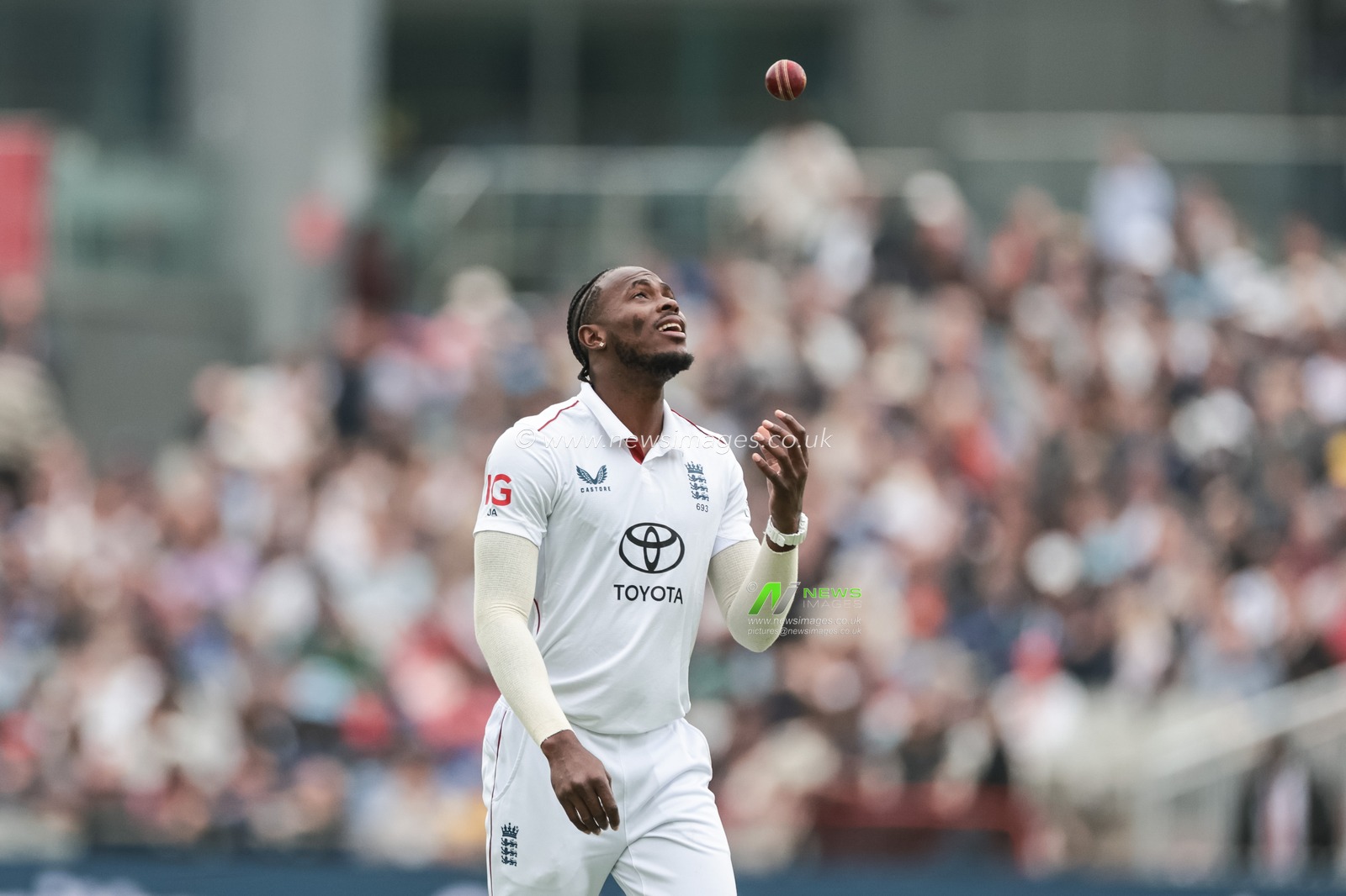 Jofra Archer of England inspects the ball as he prepares to bowl during the 4th Rothesay Test Match match Day 1 England vs India at Old Trafford Cricket Ground, Manchester, United Kingdom, 22nd July 2025

(Photo by Mark Cosgrove/News Images)