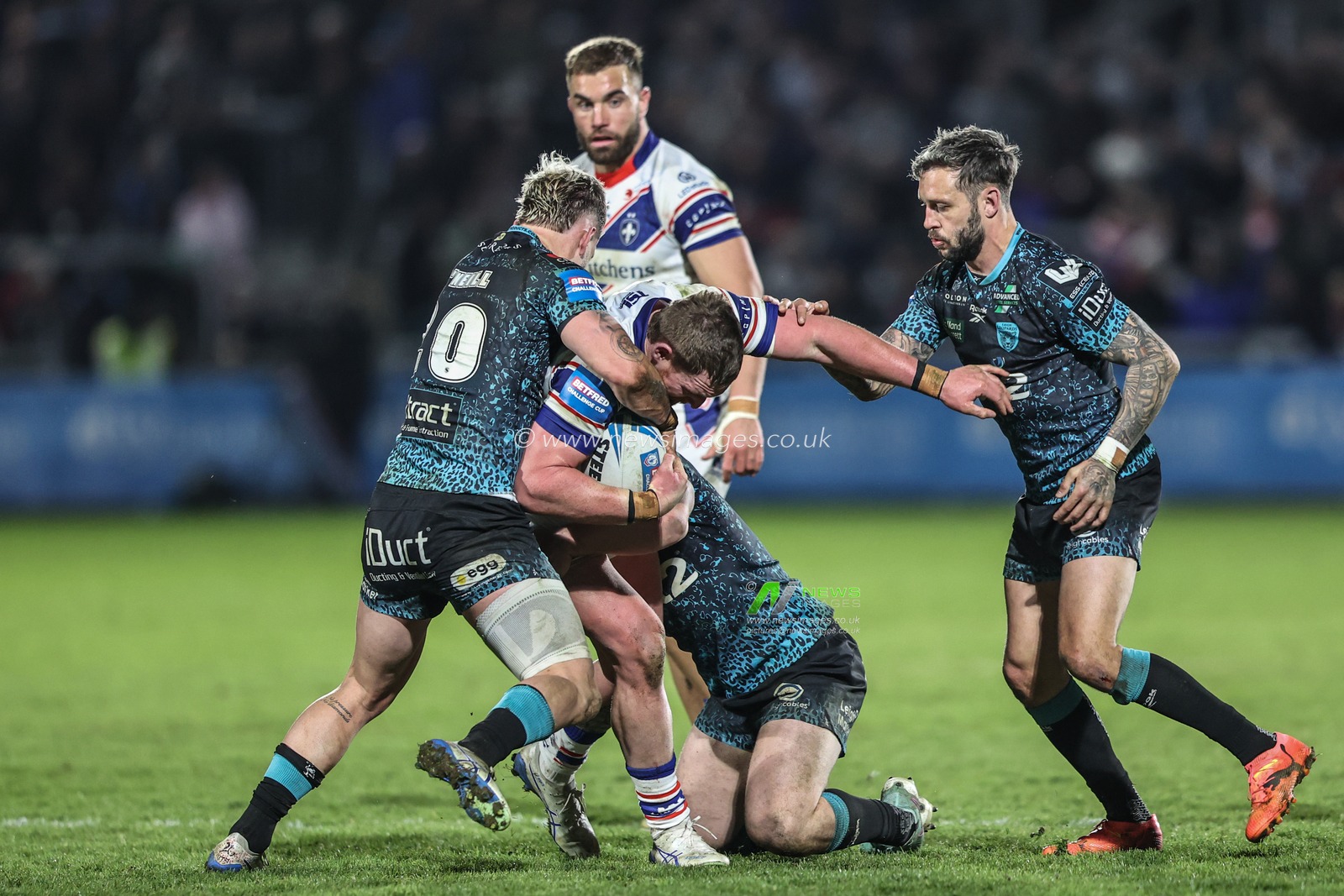 Ky Rodwell of Wakefield Trinity is tackled by Ethan O'neill of Leigh Leopards during the Betfred Challenge Cup Quarter Final match Wakefield Trinity vs Leigh Leopards at DIY Kitchens Stadium, Wakefield, United Kingdom, 4th April 2025

(Photo by Alfie Cosgrove/News Images)