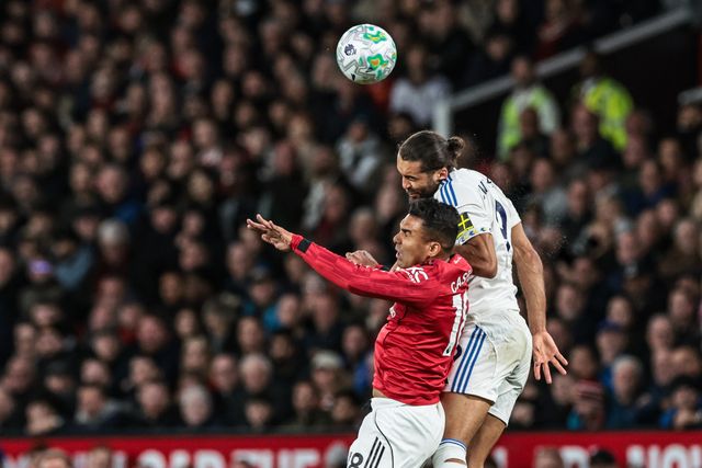 Dominic Calvert-Lewin of Leeds United jumps up to win the high ball from Casemiro of Manchester United during the Premier League match Manchester United vs Leeds United at Old Trafford, Manchester, United Kingdom on 13 April 2026

(Photo by Mark Cosgrove/News Images)