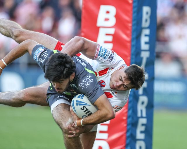 Jack Welsby of St. Helens tackles Guillermo Aispuro-Bichet of Catalan Dragons behind his own goal line for a re-set during the Betfred Super League Round 11 match St Helens vs Catalans Dragons at Totally Wicked Stadium, St Helens, United Kingdom, 15th May 2025

(Photo by Mark Cosgrove/News Images)