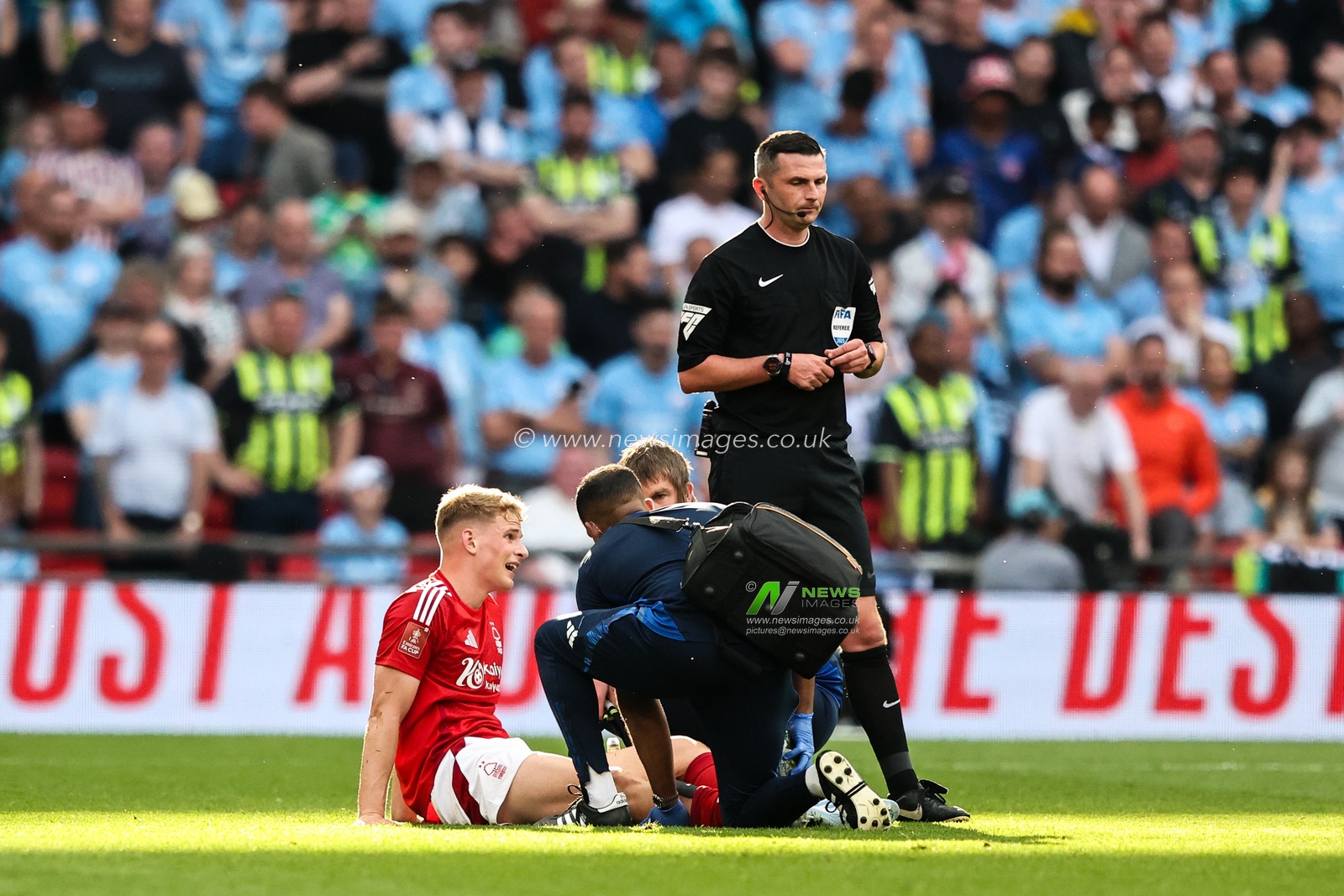Zach Abbott of Nottingham Forest receives medical treatment during the Emirates FA Cup Semi-Final match Nottingham Forest vs Manchester City at Wembley Stadium, London, United Kingdom, 26th April 2025

(Photo by Alfie Cosgrove/News Images)