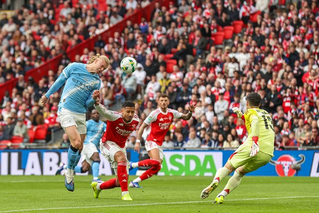 Erling Haaland of Manchester City heads the ball toward goal under challenge from William Saliba of Arsenal during the Carabao Cup Final match Arsenal vs Manchester City at Emirates, London, United Kingdom on 22 March 2026

(Photo by Alfie Cosgrove/News Images)