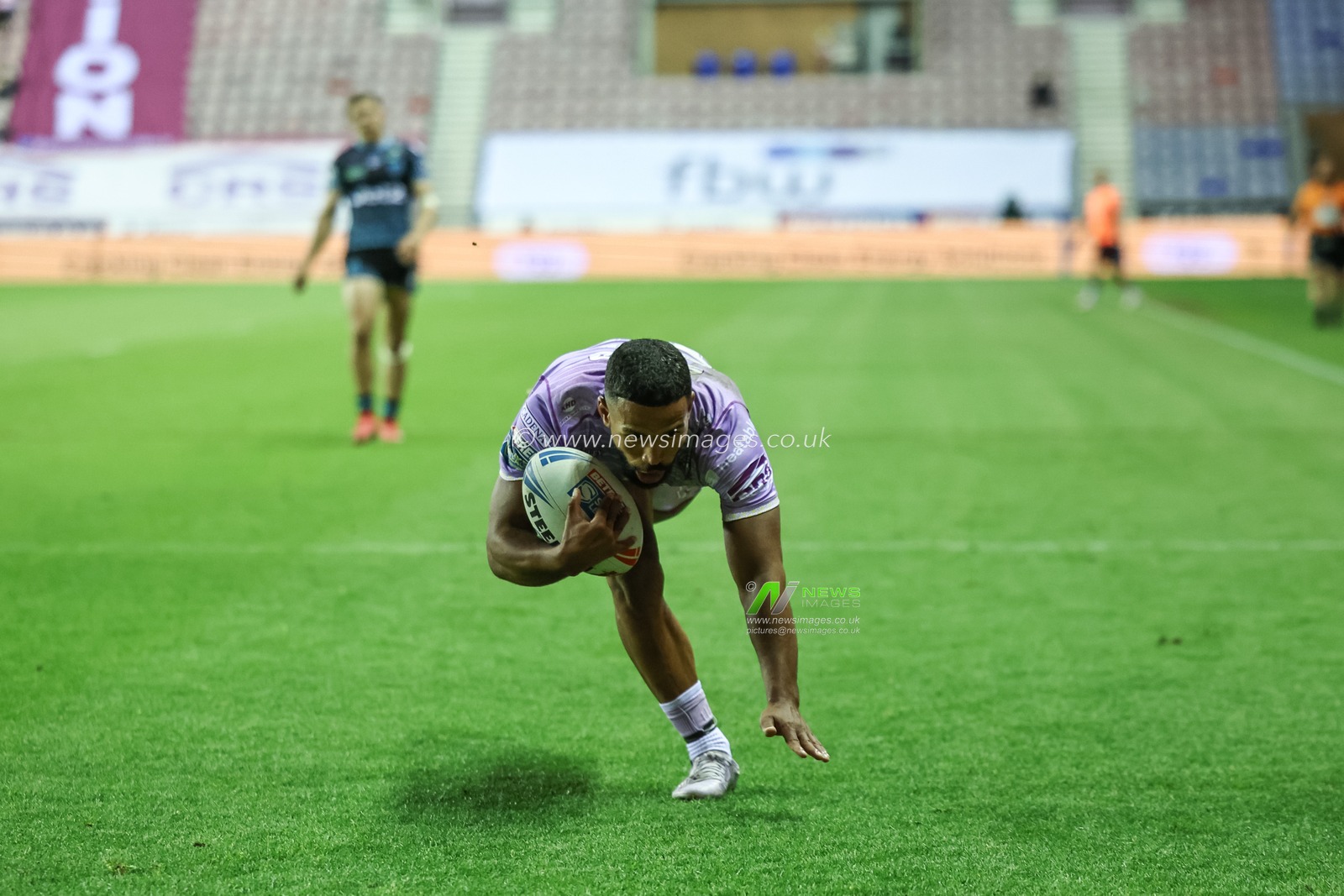 ï»¿ï»¿Kruise Leeming of Wigan Warriors goes over for a try during the Betfred Super League Round 11 match Wigan Warriors vs Leigh Leopards at The Brick Community Stadium, Wigan, United Kingdom, 16th May 2025

(Photo by Mark Cosgrove/News Images)