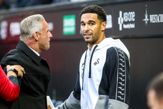 Ben Cabango of Swansea City talks to former Swansea City player Lee Trundle during the Sky Bet Championship match Swansea City vs Watford at Swansea.com Stadium, Swansea, United Kingdom on 01 September 2026

(Photo by Andrew Lewis/News Images)