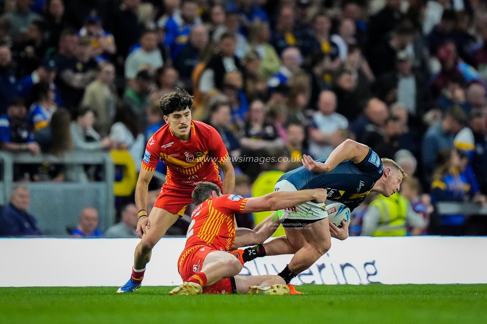 Lachie Miller of Leeds Rhinos is tackled by Ben Condon of Catalans Dragons during the Betfred Super League round 9 match Leeds Rhinos vs Catalans Dragons at AMT Headingley Stadium, Leeds, United Kingdom on 24 April 2026

(Photo by Maynard Manyowa/News Images)