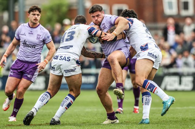 Joe Philbin of Warrington Wolves is tackled during the Betfred Super League Round 11 match Wakefield Trinity vs Warrington Wolves at DIY Kitchens Stadium, Wakefield, United Kingdom, 18th May 2025

(Photo by Alfie Cosgrove/News Images)