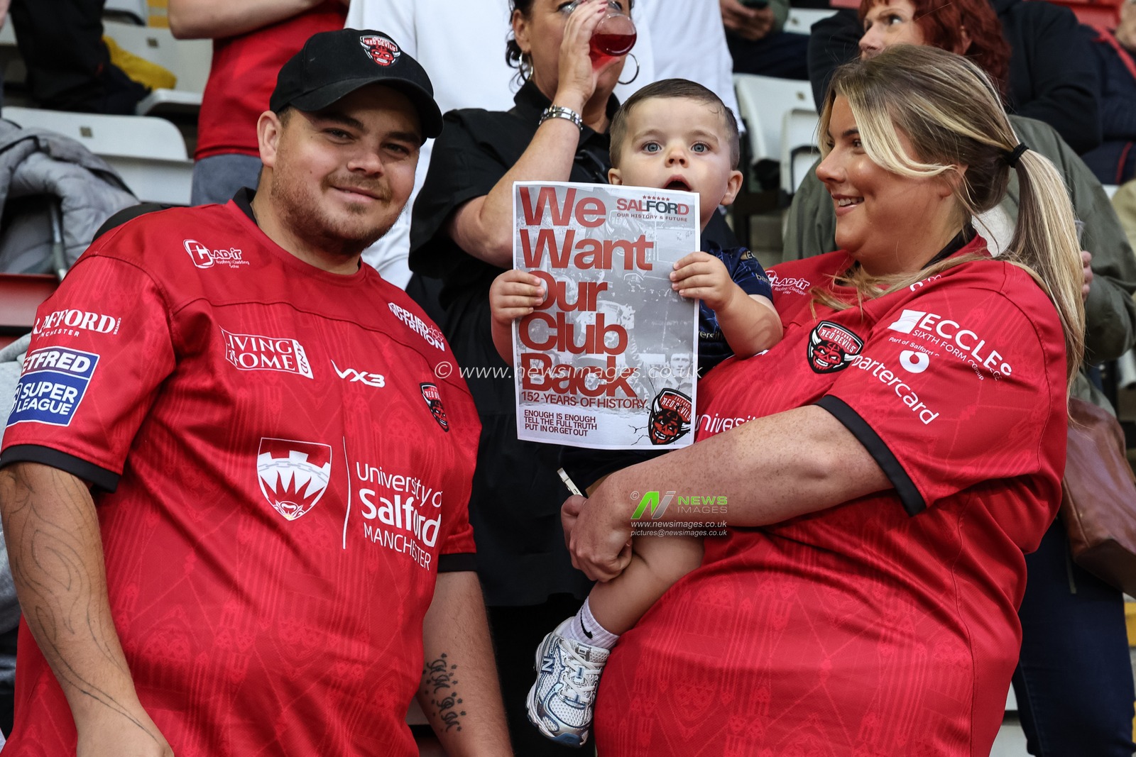 Salford Red Devils fans protest holding up a signs saying “We want out club back” during the Betfred Super League Round 23 match Leigh Leopards vs Salford Red Devils at Leigh Sports Village, Leigh, United Kingdom, 22nd August 2025

(Photo by Mark Cosgrove/News Images)