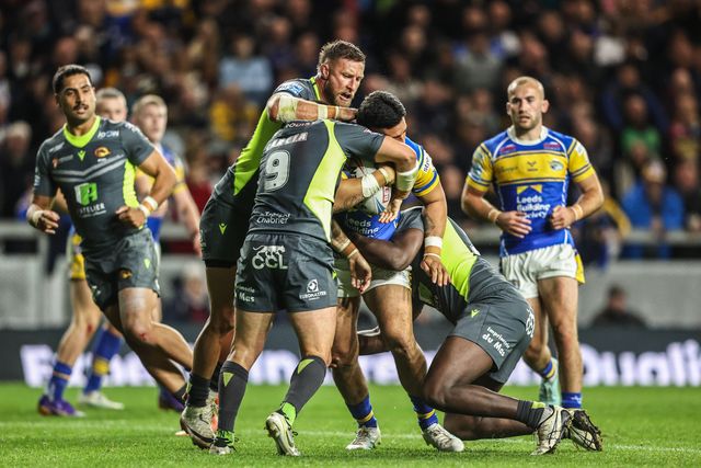 Keenan Palasia of Leeds Rhinos is tackled by Benjamin Garcia of Catalan Dragons during the Betfred Super League round 26 match Leeds Rhinos vs Catalans Dragons at Headingley Stadium, Leeds, United Kingdom, 11th September 2025

(Photo by Alfie Cosgrove/News Images)