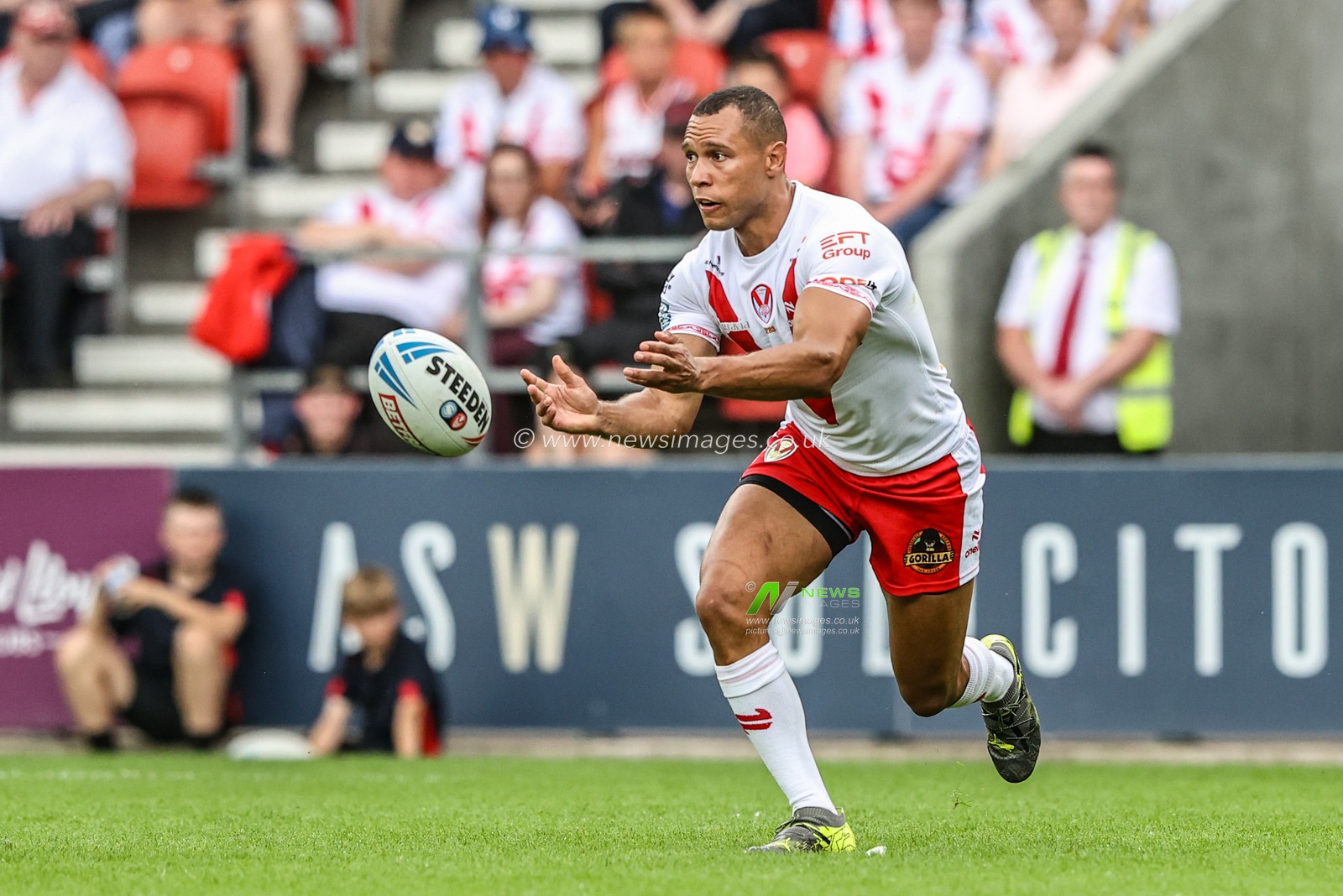 Moses Mbye of St. Helens passes the ball during the Betfred Super League round 16 match St Helens vs Salford Red Devils at Totally Wicked Stadium, St Helens, United Kingdom, 29th June 2025

(Photo by Alfie Cosgrove/News Images)