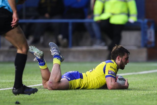 Adam Holroyd of Warrington Wolves goes over for a try and makes the score 6-4 during the Betfred Challenge Cup match Widnes Vikings vs Warrington Wolves at DCBL Stadium, Widnes, United Kingdom, 15th March 2025

(Photo by Gareth Evans/News Images)