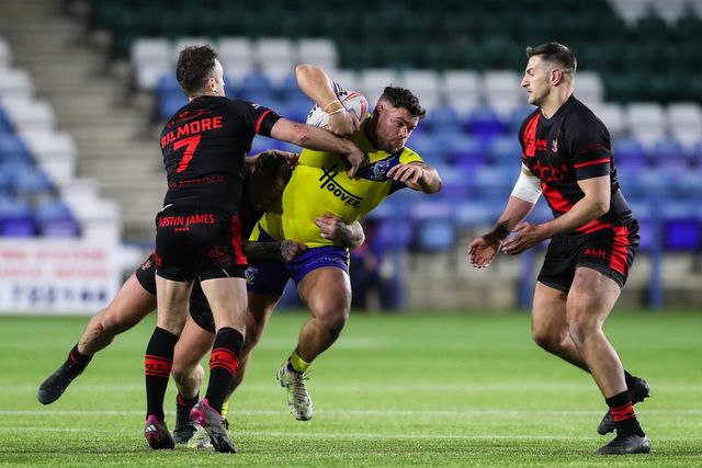 Joe Philbin of Warrington Wolves is tackled during the Betfred Challenge Cup match Widnes Vikings vs Warrington Wolves at DCBL Stadium, Widnes, United Kingdom, 15th March 2025

(Photo by Gareth Evans/News Images)