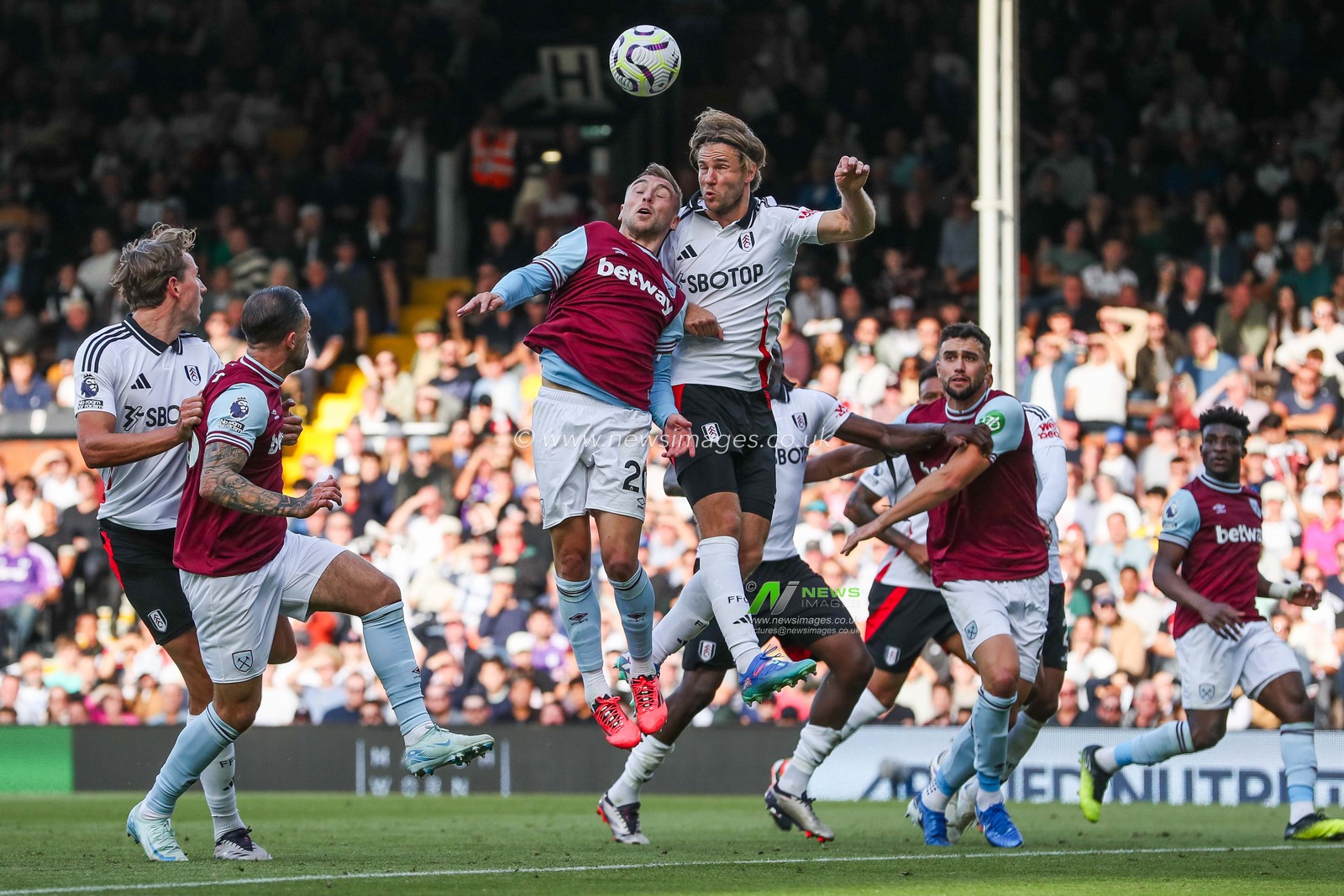 Jarrod Bowen of West Ham United jumps for the ball with Joachim Andersen of Fulham during the Premier League match Fulham vs West Ham United at Craven Cottage, London, United Kingdom, 14th September 2024

(Photo by Izzy Poles/News Images)