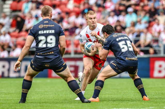 George Delaney of St. Helens is tackled during the Betfred Super League round 16 match St Helens vs Salford Red Devils at Totally Wicked Stadium, St Helens, United Kingdom, 29th June 2025

(Photo by Alfie Cosgrove/News Images)