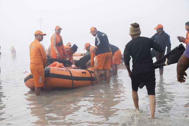 National Disaster Response Force (NDRF) rescuing an ill pilgrim Gangasagar Island, around 160 km south of Kolkata, on January 13, 2025. Sadhus and Hindu pilgrim's from all over the country come for the annual Hindu holy festival Gangasagar Mela with more than four hundred thousand Hindu pilgrims gathering at the Gangasagar to take a 'holy dip' in the ocean at the confluence of the River Ganges and the Bay of Bengal on the occasion of Makar Sankranti, a holy day of the Hindu calendar considered to be of great religious significance in Hindu mythology..Pictures by Debajyoti Chakraborty.(Photo: Debajyoti Chakraborty/News Images)