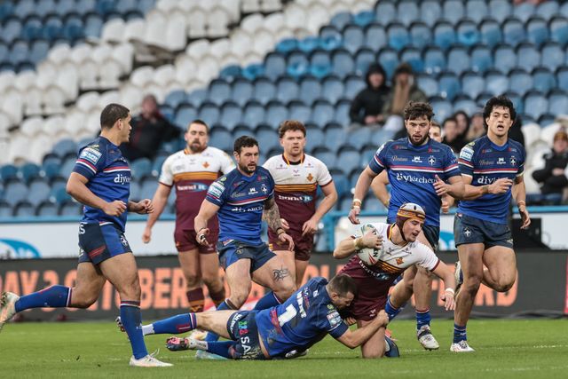 George Flanagan Jnr of Huddersfield Giants goes over for a try Max Jowitt of Wakefield Trinity during the Betfred Super League Round 2 match Huddersfield Giants vs Wakefield Trinity at Accu Stadium, Huddersfield, United Kingdom on 22 February 2026

(Photo by Mark Cosgrove/News Images)