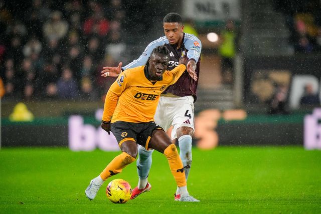Mateus Mane of Wolverhampton Wanderers battles for the ball  Ezri Konsa of Aston Villa during the Premier League match Wolverhampton Wanderers vs Aston Villa at Molineux, Wolverhampton, United Kingdom on 27 February 2026

(Photo by Maynard Manyowa/News Images)