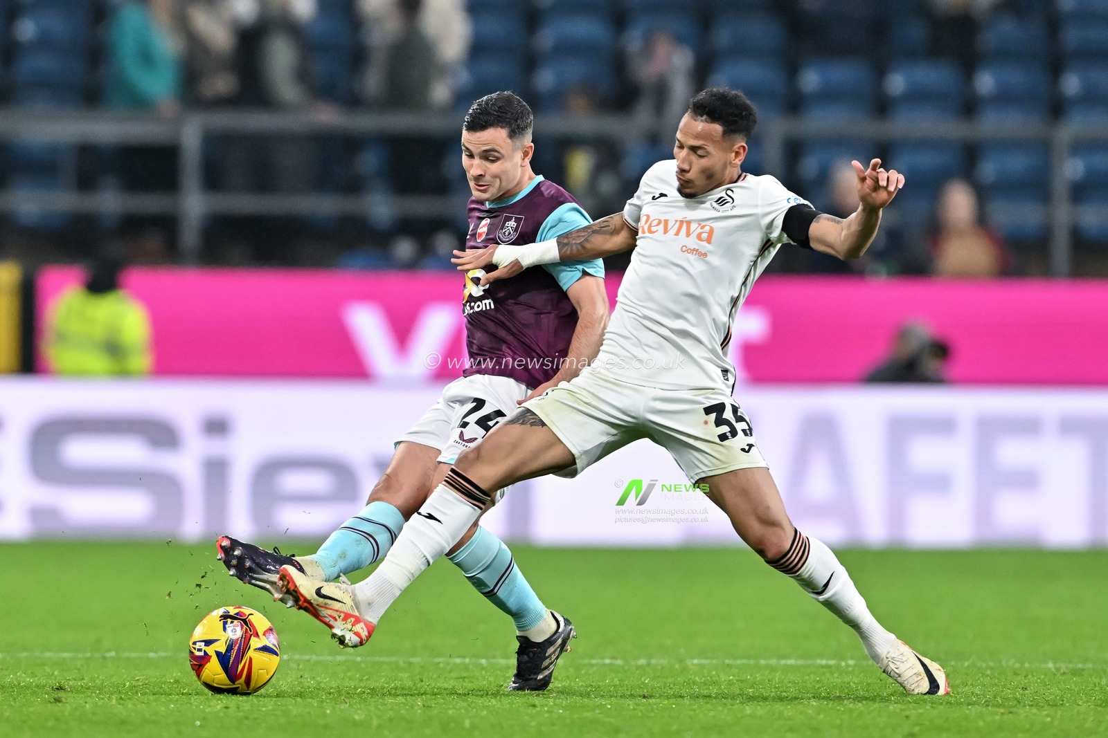 Josh Cullen of Burnley passes the ball while under pressure from Ronald of Swansea City during the Sky Bet Championship match Burnley vs Swansea City at Turf Moor, Burnley, United Kingdom, 10th November 2024

(Photo by Cody Froggatt/News Images)
