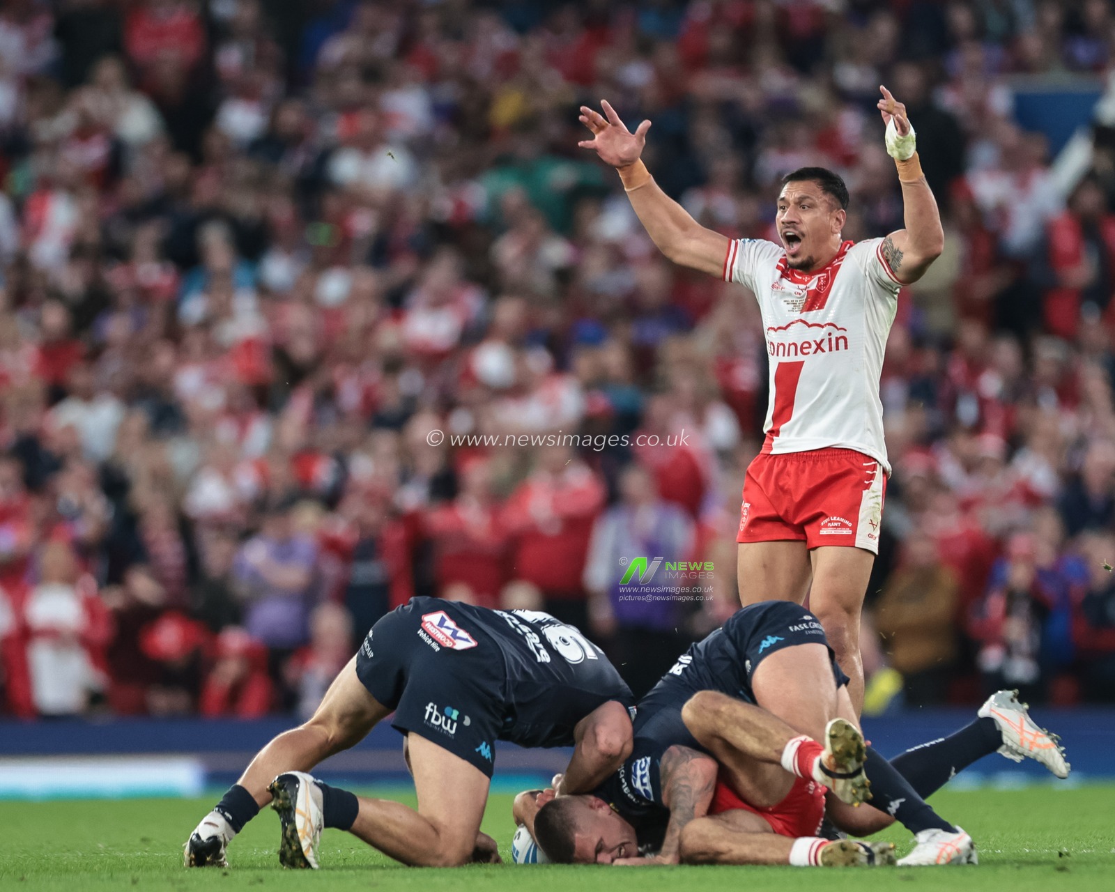 Tyrone May of Hull KR receives a heavy tackle off Brad O'neill of Wigan Warriors during the 2025 Betfred Super League Grand Final Hull KR v Wigan Warriors at Old Trafford, Manchester, United Kingdom, 11th October 2025

(Photo by Mark Cosgrove/News Images)
