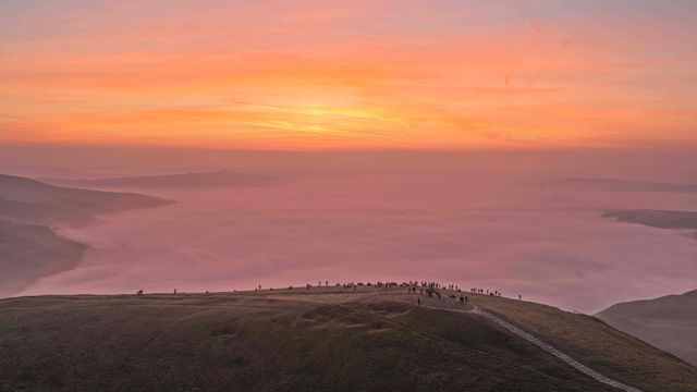 Sunrise hikers walk to the summit of Mam Tor as they watch the sunrise and admire the cloud inversion in the Hope Valley at Mam Tor in the Peak District at Mam Tor, Castleton, United Kingdom on 21 March 2026

(Photo by Mark Cosgrove/News Images)