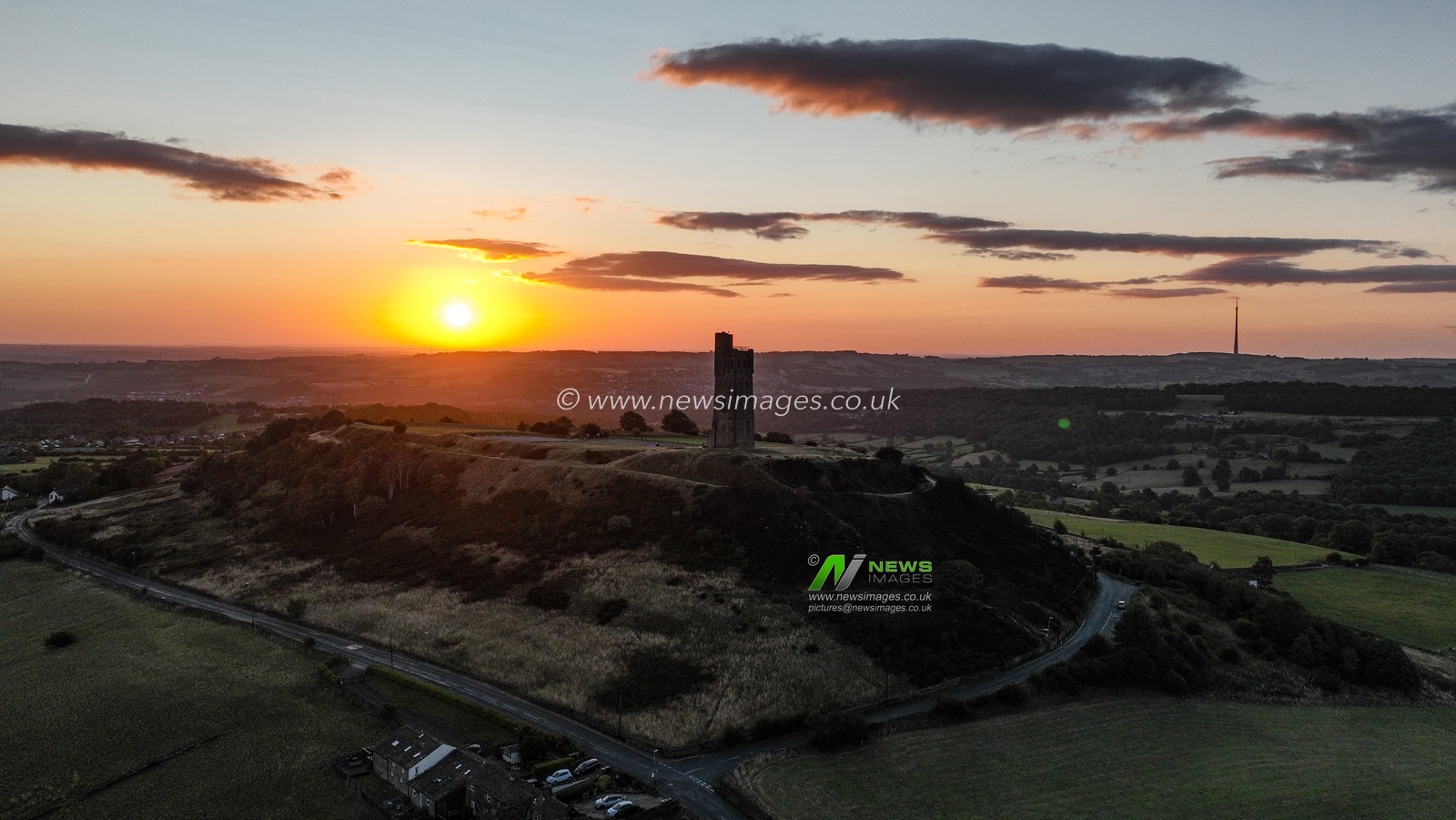 The Sun rises over Victoria Tower, Castle Hill, Huddersfield, United Kingdom, 9th August 2025

(Photo by Alfie Cosgrove/News Images)