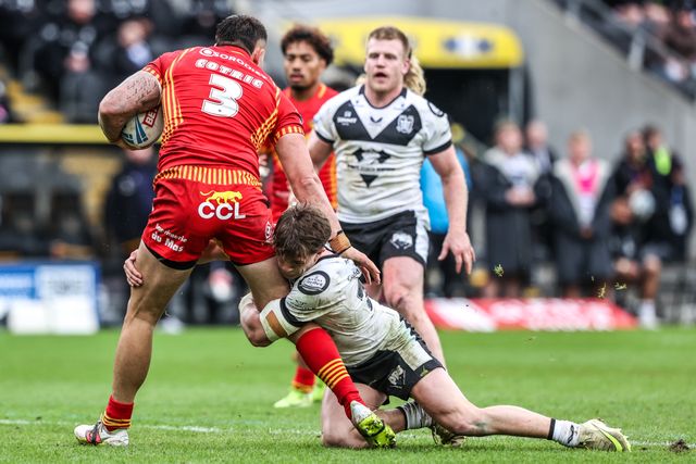 Nick Čotrić of Catalans Dragons is tackled by Logan Moy of Hull FC during the Betfred Super League round 6 match Hull FC vs Catalans Dragons at MKM Stadium, Hull, United Kingdom on 29 March 2026

(Photo by Alfie Cosgrove/News Images)
