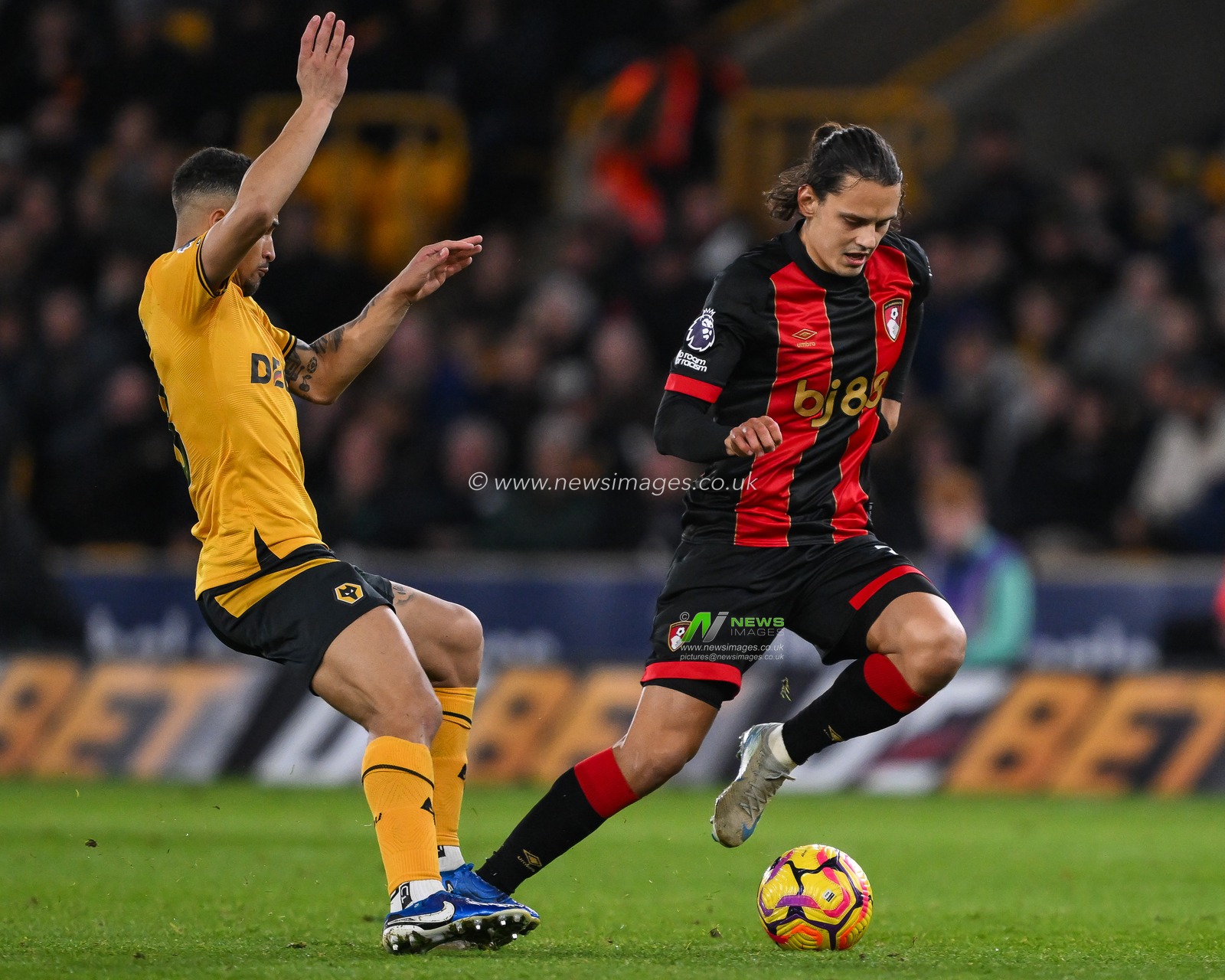 Enes Ãœnal of Bournemouth skips past JoÃ£o Gomes of Wolverhampton Wanderers during the Premier League match Wolverhampton Wanderers vs Bournemouth at Molineux, Wolverhampton, United Kingdom, 30th November 2024

(Photo by Craig Thomas/News Images)