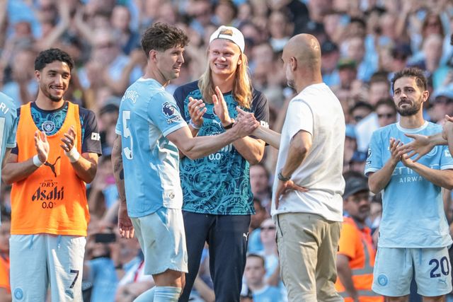 John Stones of Manchester City shakes hands with Pep Guardiola manager of Manchester City after he’s leaves the field of play to a standing ovation as fans sing, ‘Jonny Stones’ during the Premier League match Manchester City vs Aston Villa at Etihad Stadium, Manchester, United Kingdom on 24 May 2026

(Photo by Mark Cosgrove/News Images)