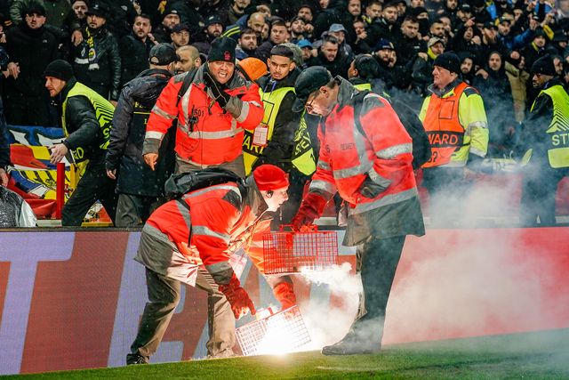 Stewards battle to contain flares thrown on to the pitch prior to kick off during the UEFA Europa League 
Knockout Round Play-offs match Nottingham Forest vs Fenerbahce at City Ground, Nottingham, United Kingdom on 26 February 2026

(Photo by Maynard Manyowa/News Images)