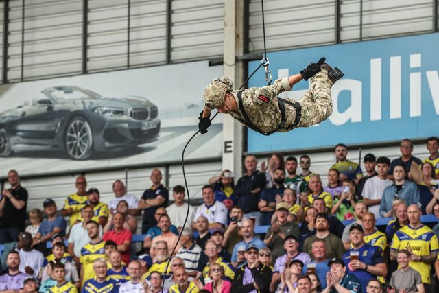 The British Marines deliver the match ball during the Betfred Super League round 15 match Warrington Wolves vs Huddersfield Giants at Halliwell Jones Stadium, Warrington, United Kingdom, 21st June 2025

(Photo by Alfie Cosgrove/News Images)
