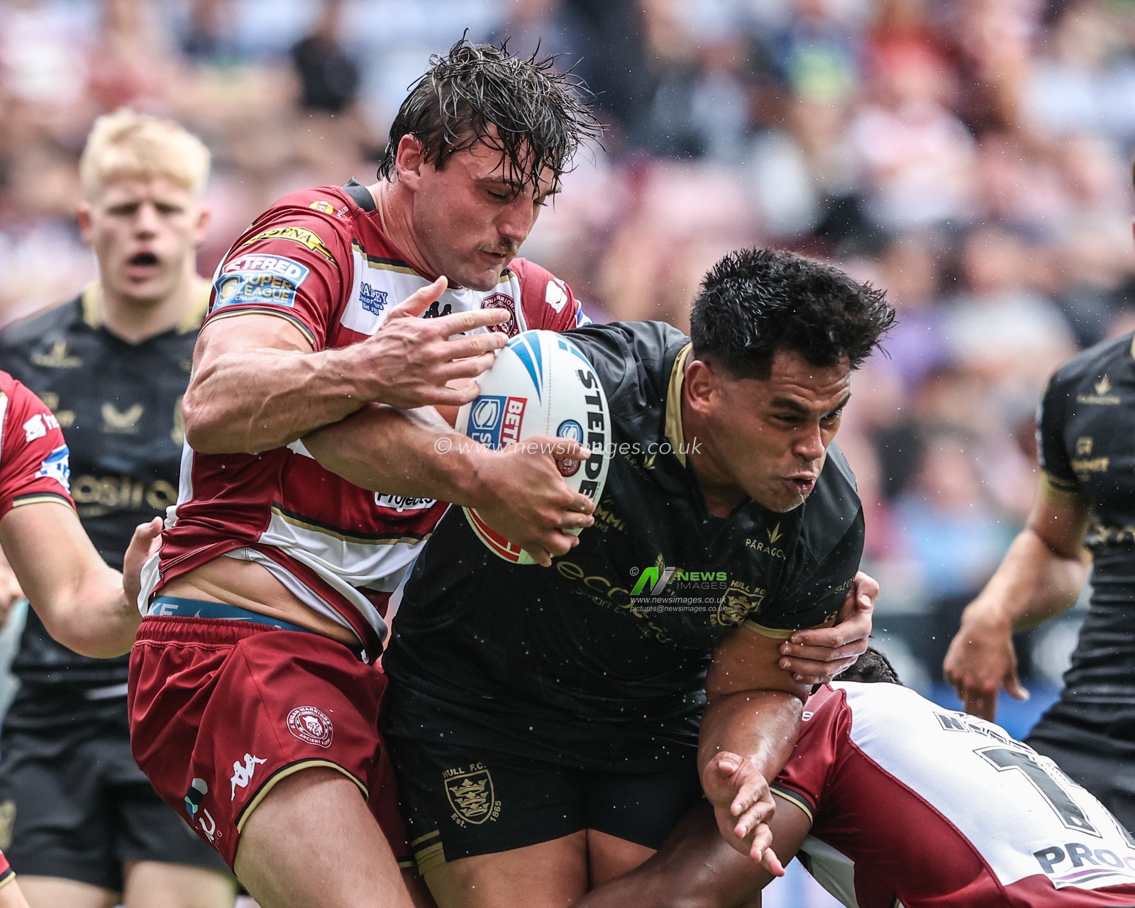 Herman Eseâ€™ese of Hull FC is tackled during the Betfred Super League Round 19 match Wigan Warriors vs Hull FC at The Brick Community Stadium, Wigan, United Kingdom, 19th July 2025

(Photo by Alfie Cosgrove/News Images)