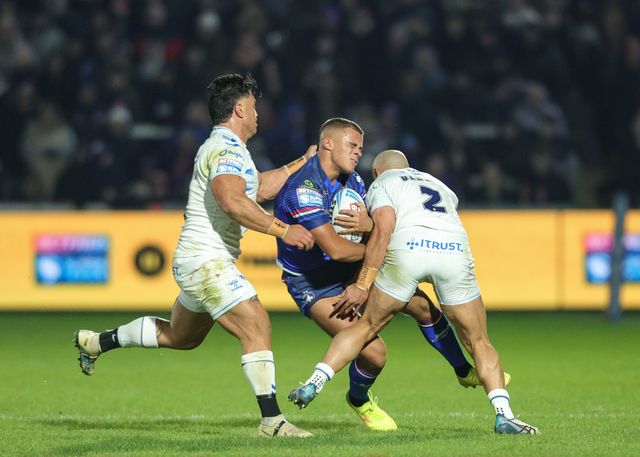 Corey Hall of Wakefield Trinity is tackled by Paul Ulberg of Toulouse Olympique  during the Betfred Super League Round 1 match Wakefield Trinity vs Toulouse Olympique at DIY Kitchens Stadium, Wakefield, United Kingdom on 14 February 2026

(Photo by Richard Bierton/News Images)