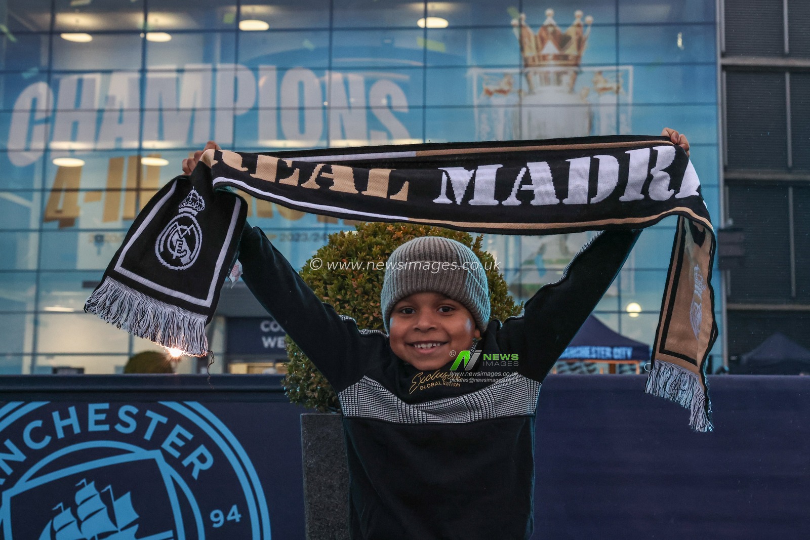 A young Real Madrid fan holds up his scarf during the UEFA Champions League Knockout Round Play-off Manchester City v Real Madrid at Etihad Stadium, Manchester, United Kingdom, 11th February 2025

(Photo by Mark Cosgrove/News Images)