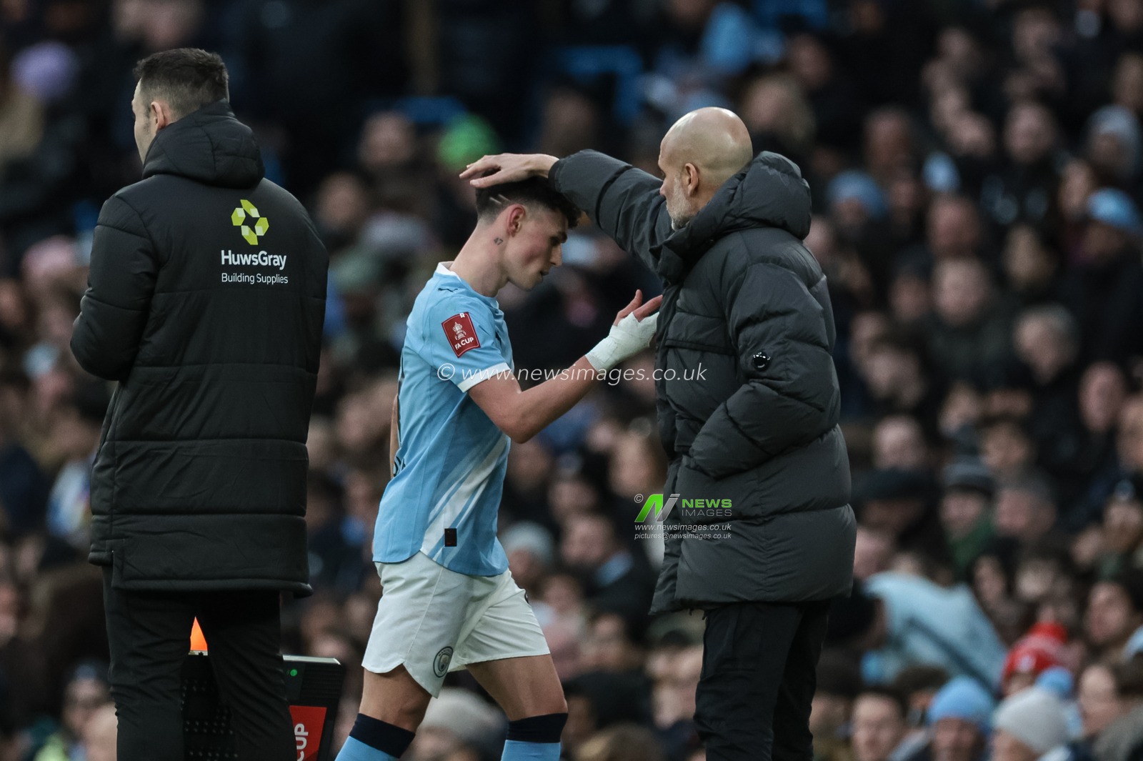 Pep Guardiola manager of Manchester City pats Phil Foden of Manchester City on the head as he’s subbed during the Emirates FA Cup 4th Round match Manchester City vs Salford City at Etihad Stadium, Manchester, United Kingdom on 14 February 2026

(Photo by Mark Cosgrove/News Images)