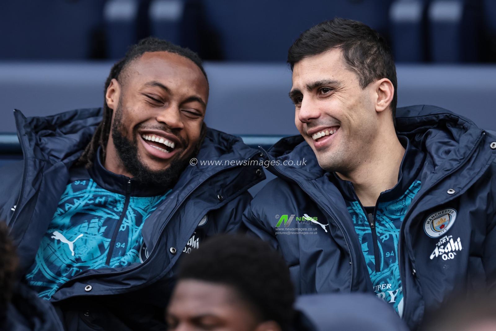 Antonie Semenyo of Manchester City and Rodrigo of Manchester City laughing one the bench during the Emirates FA Cup 4th Round match Manchester City vs Salford City at Etihad Stadium, Manchester, United Kingdom on 14 February 2026

(Photo by Mark Cosgrove/News Images)