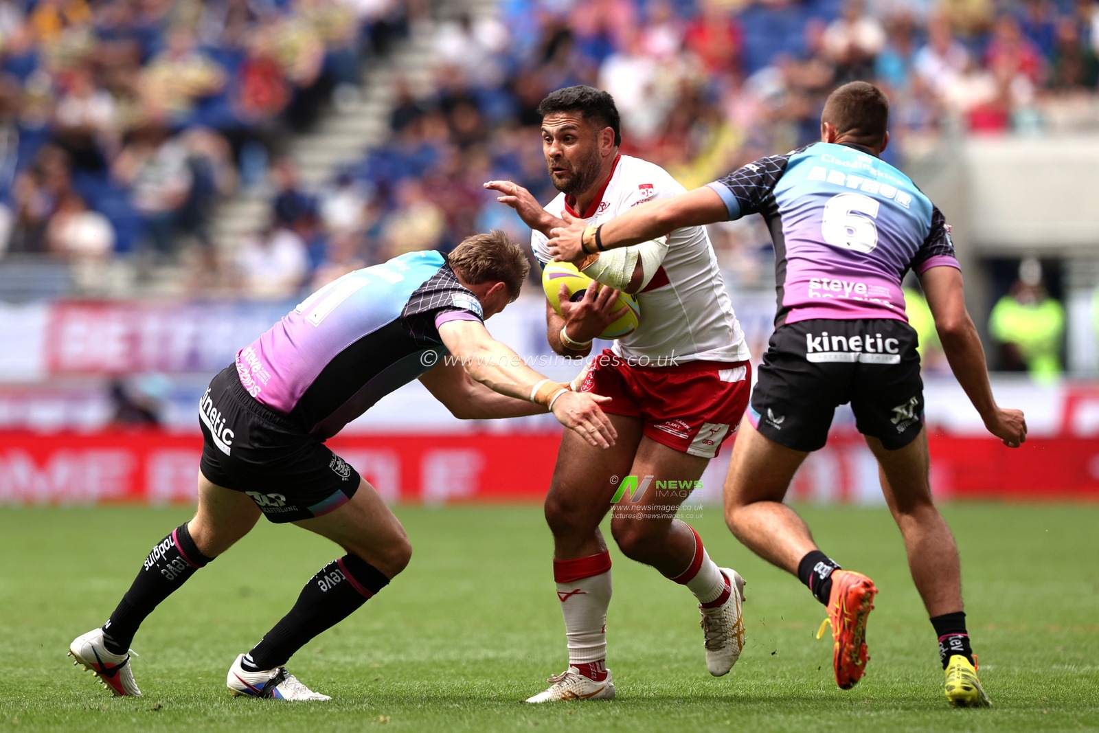 Rhyse Martin of Hull KR is tackled by Joe Batchelor of Hull FC and Jake Arthur of Hull FC during the Betfred Super League Magic Weekend match Hull KR vs Hull FC at Hill Dickinson Stadium, Liverpool, United Kingdom on 04 July 2026

(Photo by Alfie Cosgrove/News Images)