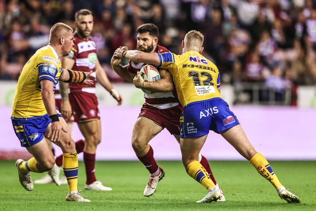 Abbas Miski of Wigan Warriors is tackled by James McDonnell of Leeds Rhinos during the Betfred Super League round 27 match Wigan Warriors vs Leeds Rhinos at The Brick Community Stadium, Wigan, United Kingdom, 19th September 2025

(Photo by Alfie Cosgrove/News Images)
