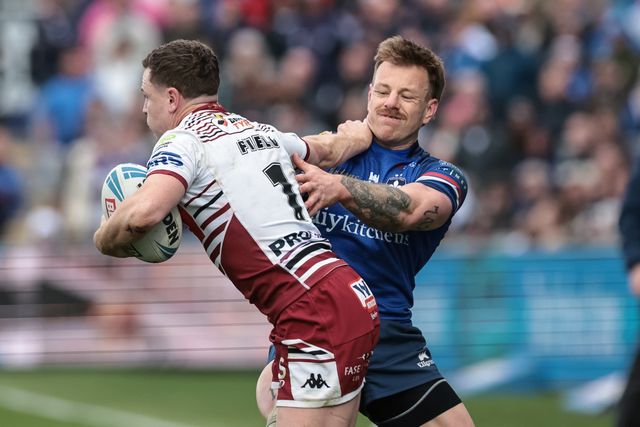 Jai Field of Wigan Warriors hands-off Tom Johnstone of Wakefield Trinity during the Betfred Challenge Cup Quarter Final match Wakefield Trinity vs Wigan Warriors at DIY Kitchens Stadium, Wakefield, United Kingdom on 12 April 2026

(Photo by Mark Cosgrove/News Images)