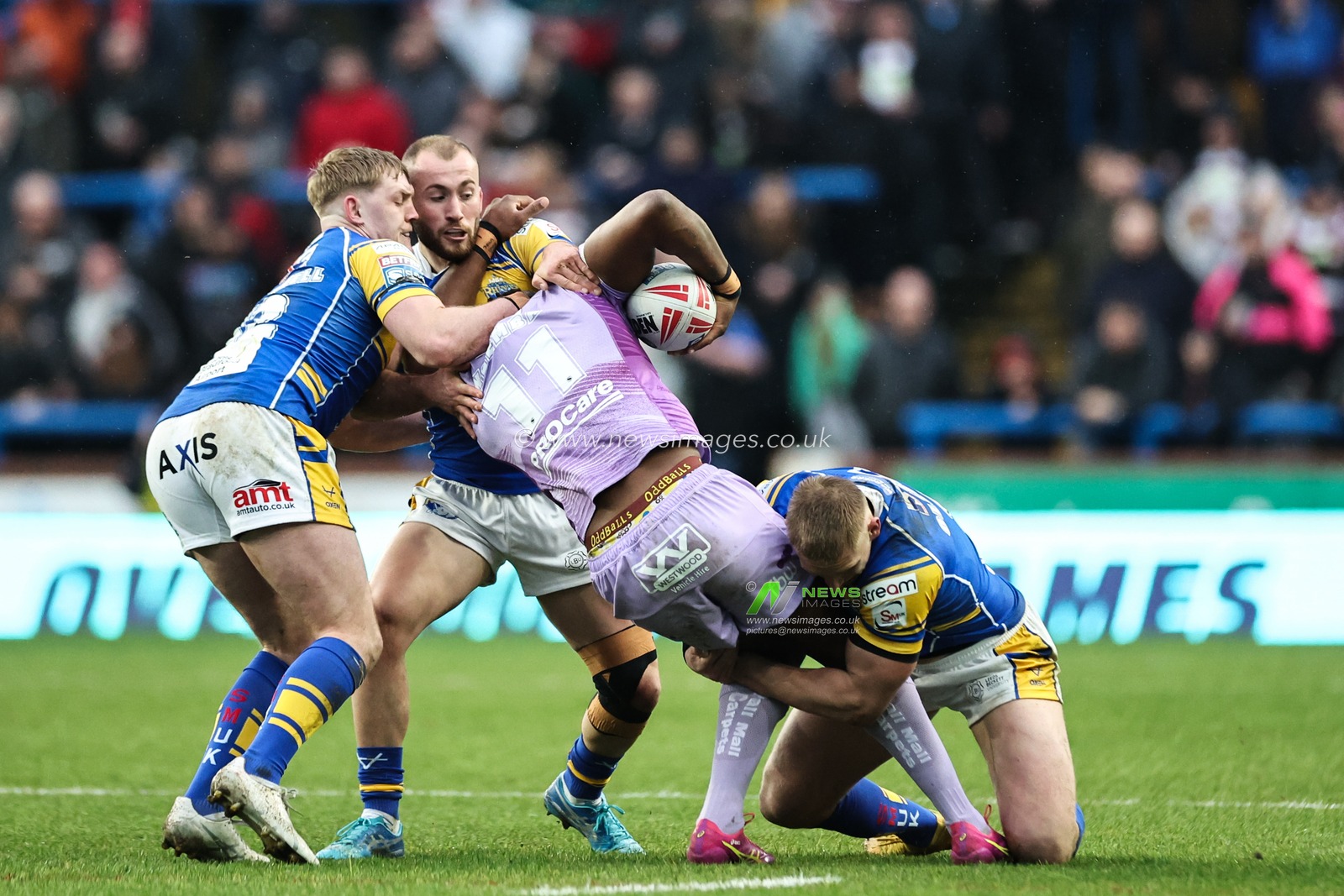 Junior Nsemba of Wigan Warriors is tackled during the Betfred Super League Round 5 match Leeds Rhinos vs Wigan Warriors at Headingley Stadium, Leeds, United Kingdom, 22nd March 2025

(Photo by Mark Cosgrove/News Images)