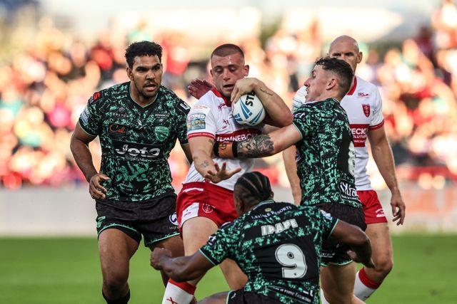 Mikey Lewis of Hull KR is tackled by Jacob Alick-Wiencke of Leigh Leopards and Adam Cook of Leigh Leopards during the Betfred Super League round 15 match Hull KR vs Leigh Leopards at Sewell Group Craven Park, Hull, United Kingdom on 19 June 2026

(Photo by Alfie Cosgrove/News Images)