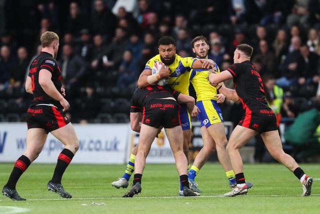 Zane Musgrove of Warrington Wolves is tackled during the Betfred Challenge Cup match Widnes Vikings vs Warrington Wolves at DCBL Stadium, Widnes, United Kingdom, 15th March 2025

(Photo by Gareth Evans/News Images)