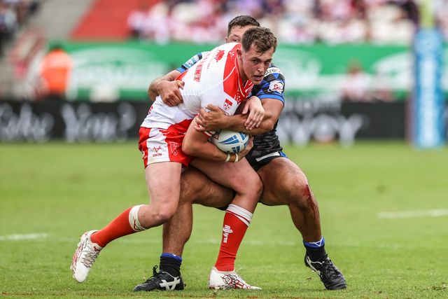Jack Broadbent of Hull KR is tackled by Ryan Hall of Leeds Rhinos during the Betfred Super League round 17 match Hull KR vs Leeds Rhinos at Sewell Group Craven Park, Kingston upon Hull, United Kingdom, 6th July 2025

(Photo by Alfie Cosgrove/News Images)