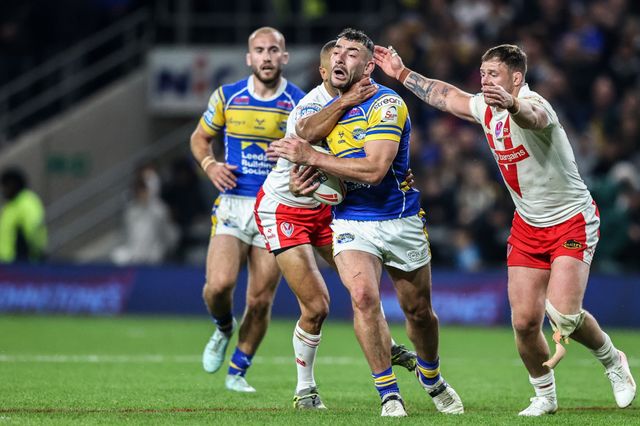 Moses Mbye of St. Helens pulls Jake Connor of Leeds Rhinos to the floor conceding a penalty during the Betfred Super League play-off Eliminator 1 match Leeds Rhinos vs St Helens at Headingley Stadium, Leeds, United Kingdom, 27th September 2025

(Photo by Alfie Cosgrove/News Images)